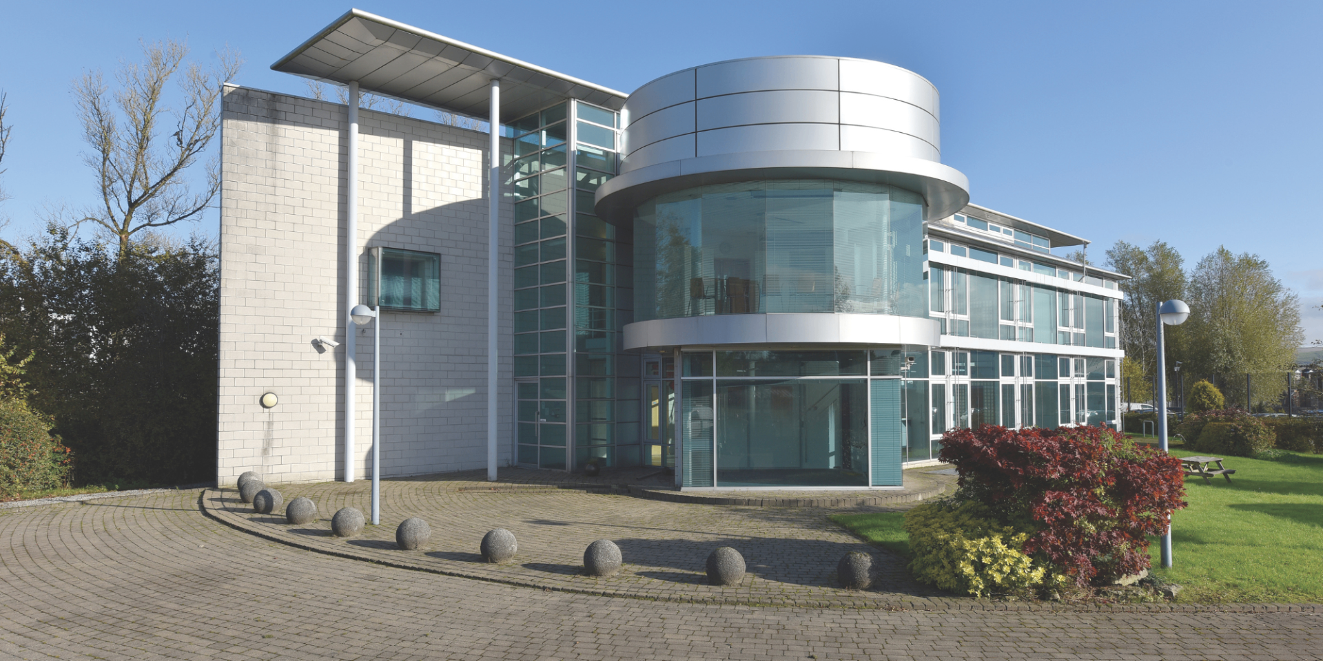 Creative Marketing headquarters — Moss Bridge House, a modern glass-fronted commercial building in Rochdale